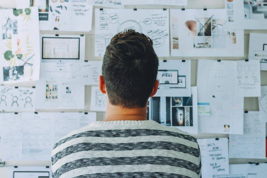 pexels-startup-stock-photos-212286 man reviewing a complex set of ideas