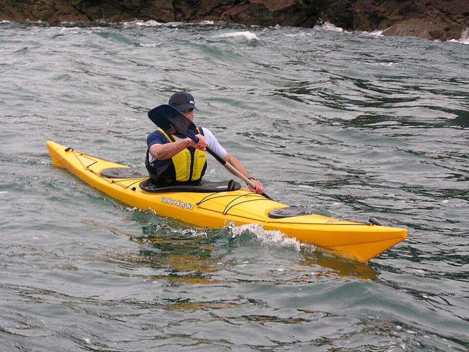 960px-Sea_Kayak man in a sea kayak on the Klamath River
