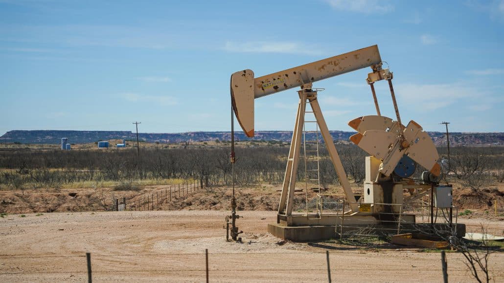 A ground based oil well in the desert.